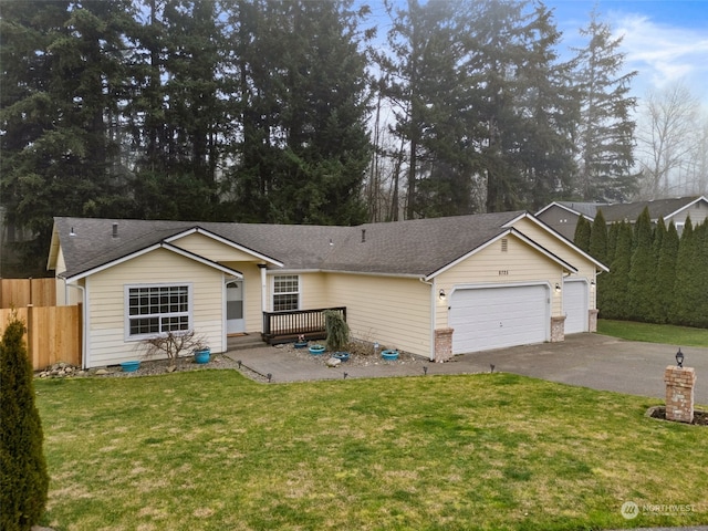 ranch-style home with a front yard and a garage