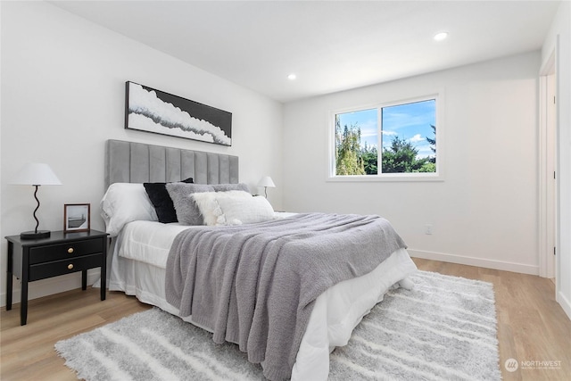 bedroom with light hardwood / wood-style flooring