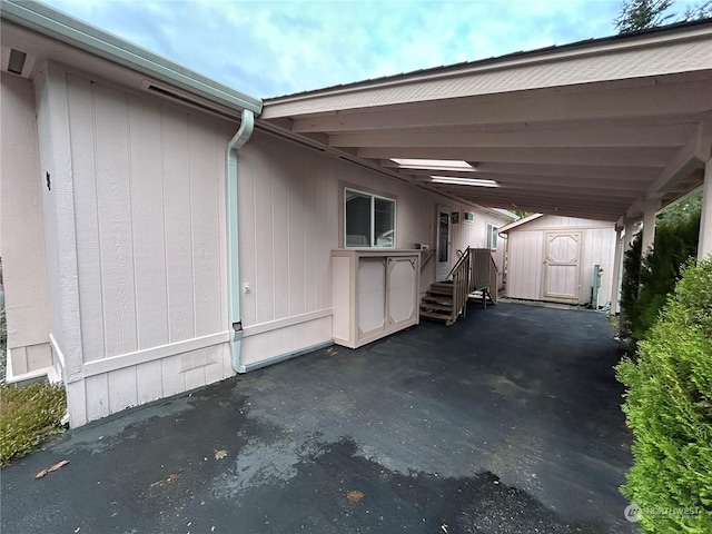 exterior space featuring a carport and a shed