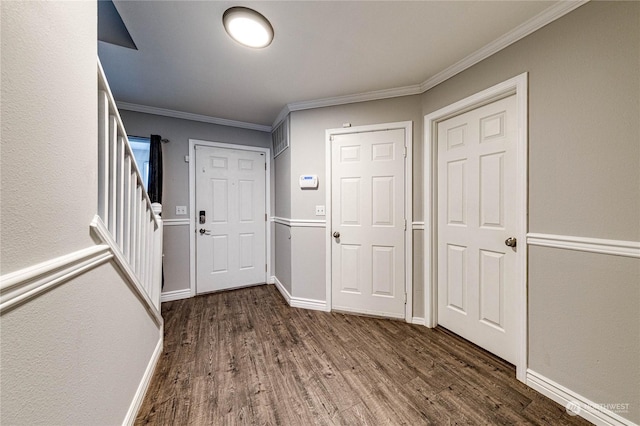 foyer featuring dark hardwood / wood-style floors and crown molding