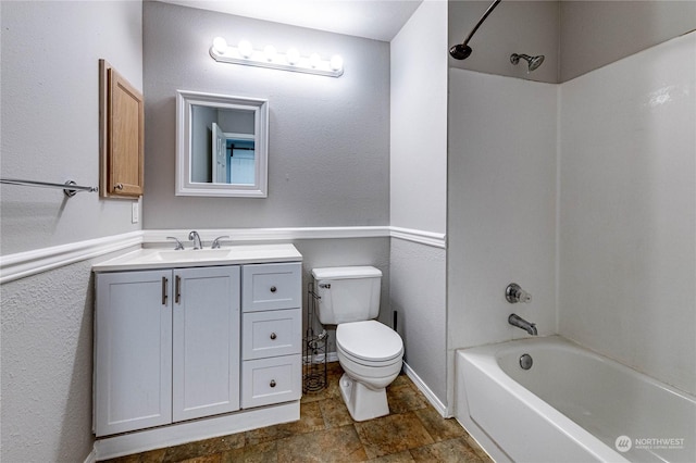 full bathroom with shower / washtub combination, vanity, and toilet