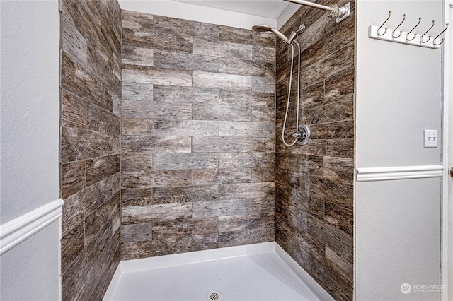 bathroom with tiled shower