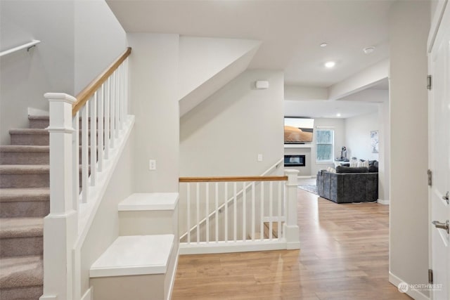 stairs featuring wood-type flooring