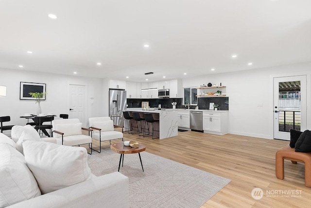 living room with light hardwood / wood-style flooring