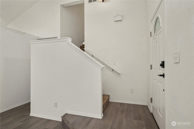 staircase with hardwood / wood-style flooring