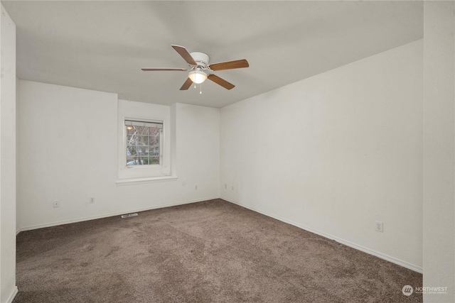 unfurnished room with carpet and ceiling fan