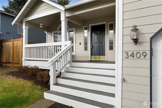 property entrance featuring a porch