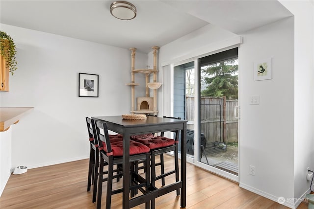 dining space featuring light hardwood / wood-style flooring