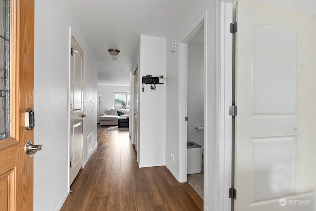 hallway featuring dark hardwood / wood-style floors