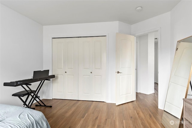 bedroom featuring a closet and hardwood / wood-style flooring