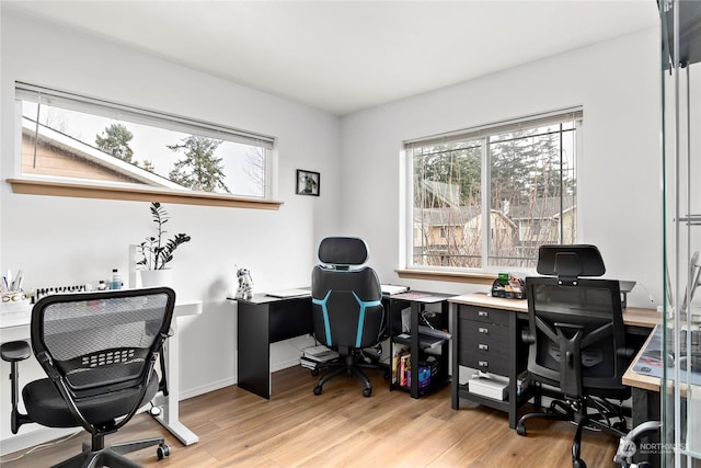 office with light hardwood / wood-style flooring