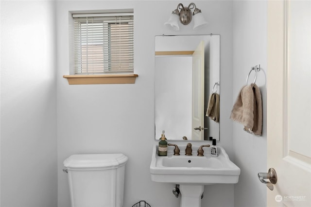 bathroom with toilet and sink