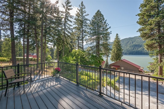 deck featuring a water and mountain view