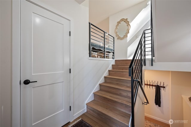 stairs featuring wood-type flooring