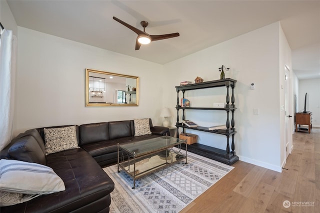 living room with ceiling fan and light wood-type flooring