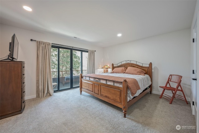 bedroom featuring access to exterior and light colored carpet