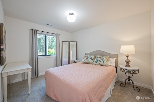 bedroom featuring light colored carpet