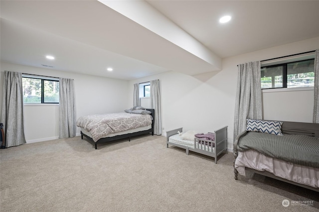 bedroom featuring light carpet