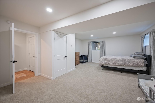 bedroom with light colored carpet