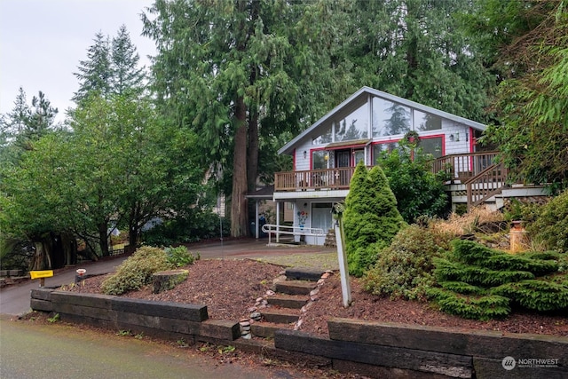 rear view of property with a deck