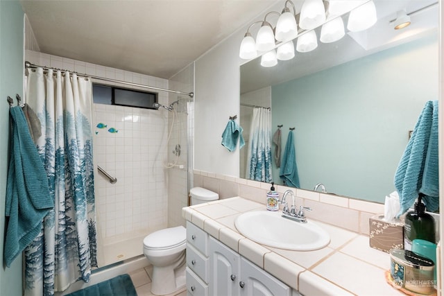 bathroom with tile patterned floors, a shower with curtain, vanity, and toilet