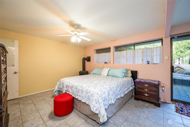 bedroom featuring ceiling fan, access to exterior, and light tile patterned floors