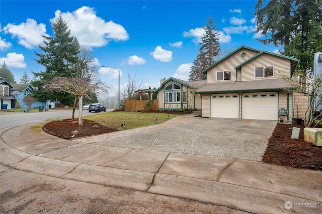 view of front of house with a front lawn and a garage