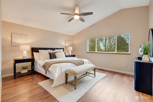 bedroom featuring ceiling fan, vaulted ceiling, and hardwood / wood-style flooring