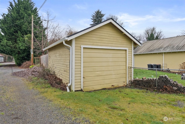 garage featuring a yard