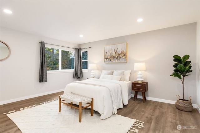 bedroom with wood-type flooring