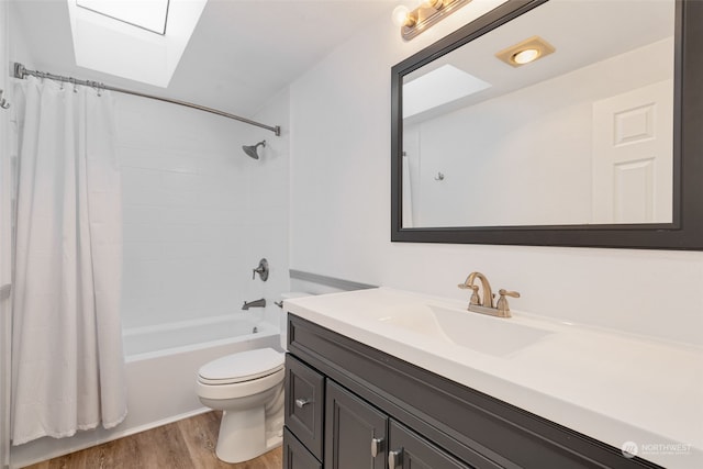 full bathroom with vanity, hardwood / wood-style flooring, toilet, and shower / tub combo with curtain