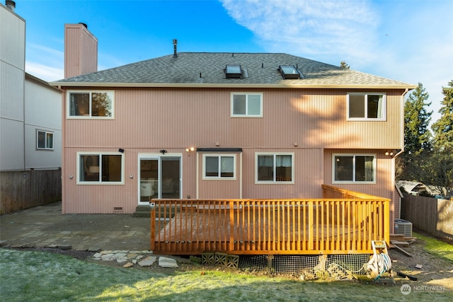 rear view of house featuring central AC, a deck, and a patio area