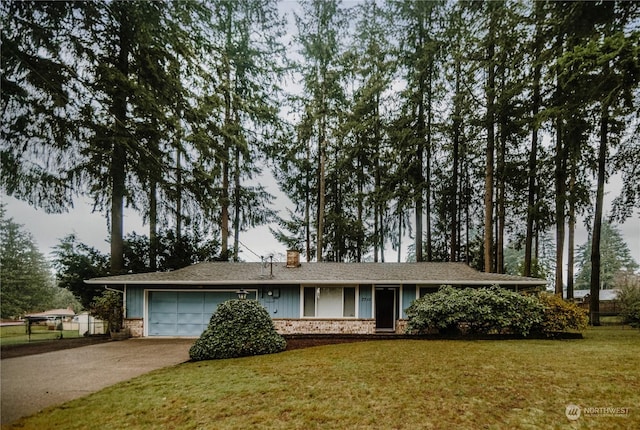 single story home with a front lawn and a garage