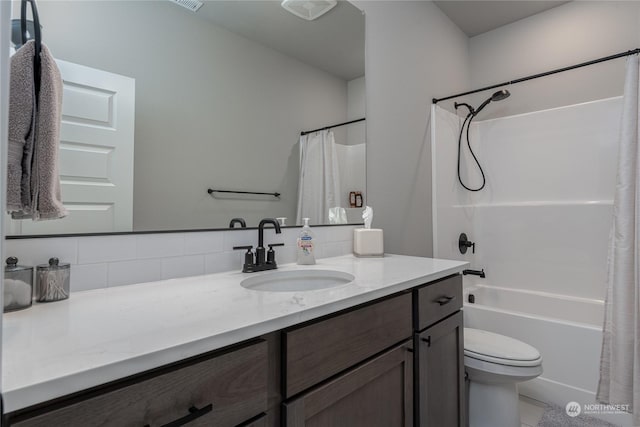 full bathroom with vanity, toilet, shower / tub combo with curtain, and decorative backsplash