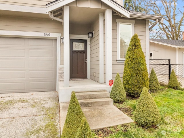 entrance to property featuring a garage