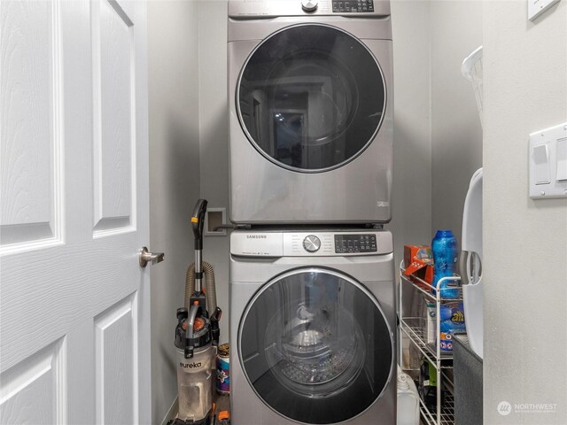 washroom with stacked washer / drying machine