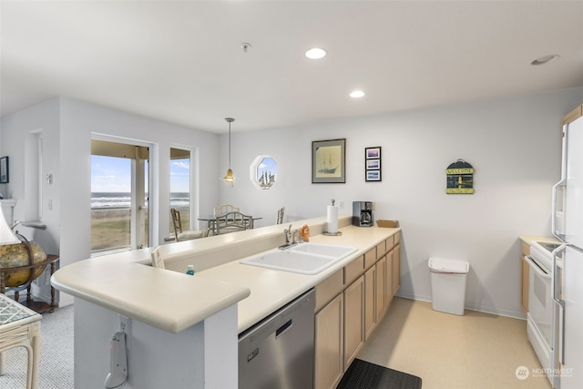 kitchen featuring dishwasher, kitchen peninsula, sink, and hanging light fixtures