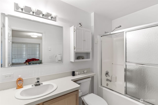 full bathroom featuring vanity, toilet, and enclosed tub / shower combo