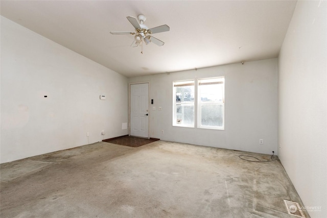 empty room featuring carpet flooring and ceiling fan