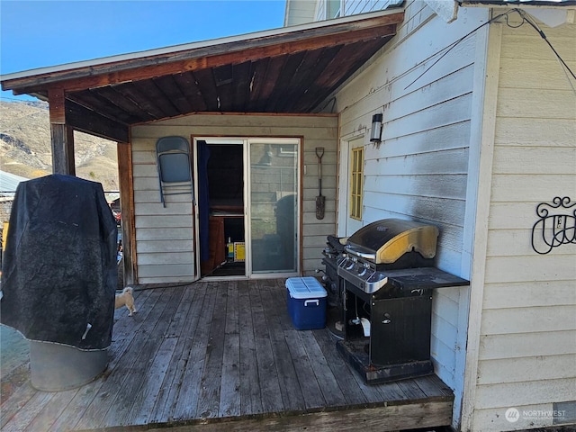 wooden terrace with area for grilling