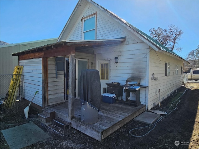 back of property with a wooden deck