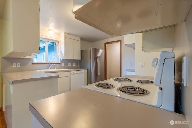 kitchen featuring dishwasher, sink, white cabinetry, electric range, and high quality fridge