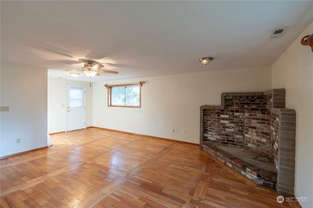 unfurnished living room with ceiling fan and hardwood / wood-style floors