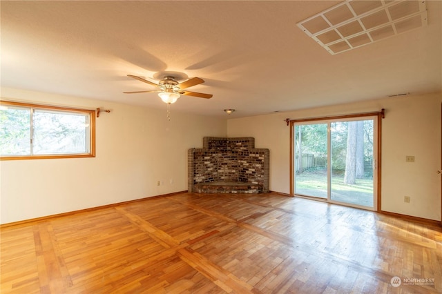 unfurnished living room featuring ceiling fan