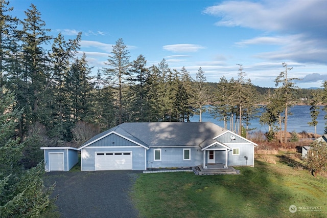 ranch-style house featuring a water view and a front yard