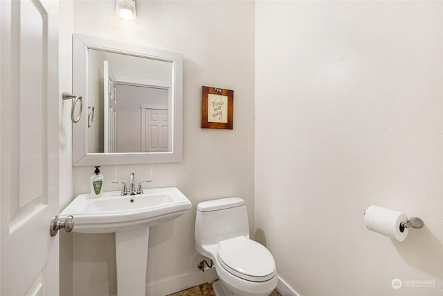 bathroom with sink and toilet