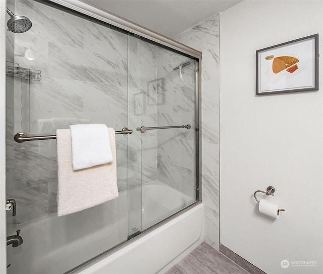 bathroom featuring enclosed tub / shower combo