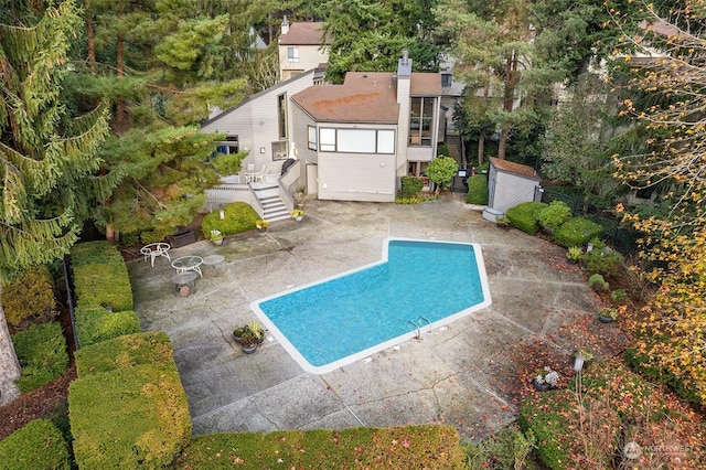 view of swimming pool with a patio area