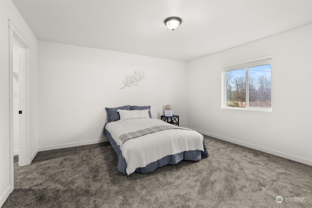 carpeted bedroom with baseboards