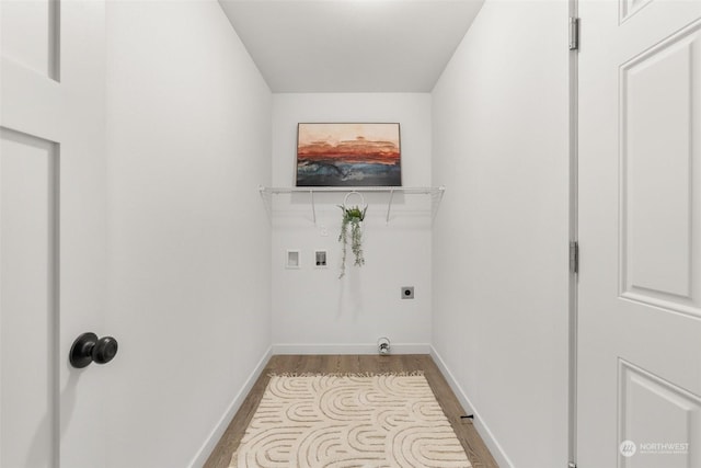 laundry area featuring hookup for a washing machine, hookup for an electric dryer, wood finished floors, laundry area, and baseboards